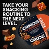 image:imageOikos REMIX Salted Caramel Nonfat Greek Yogurt with Sea Salt Praline Pretzels Dark Chocolate and Butter Toffee MixIns Delicious High Protein Yogurt Snack with 11g of Protein 45 OZ Cup