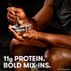 image:imageOikos REMIX Salted Caramel Nonfat Greek Yogurt with Sea Salt Praline Pretzels Dark Chocolate and Butter Toffee MixIns Delicious High Protein Yogurt Snack with 11g of Protein 45 OZ Cup